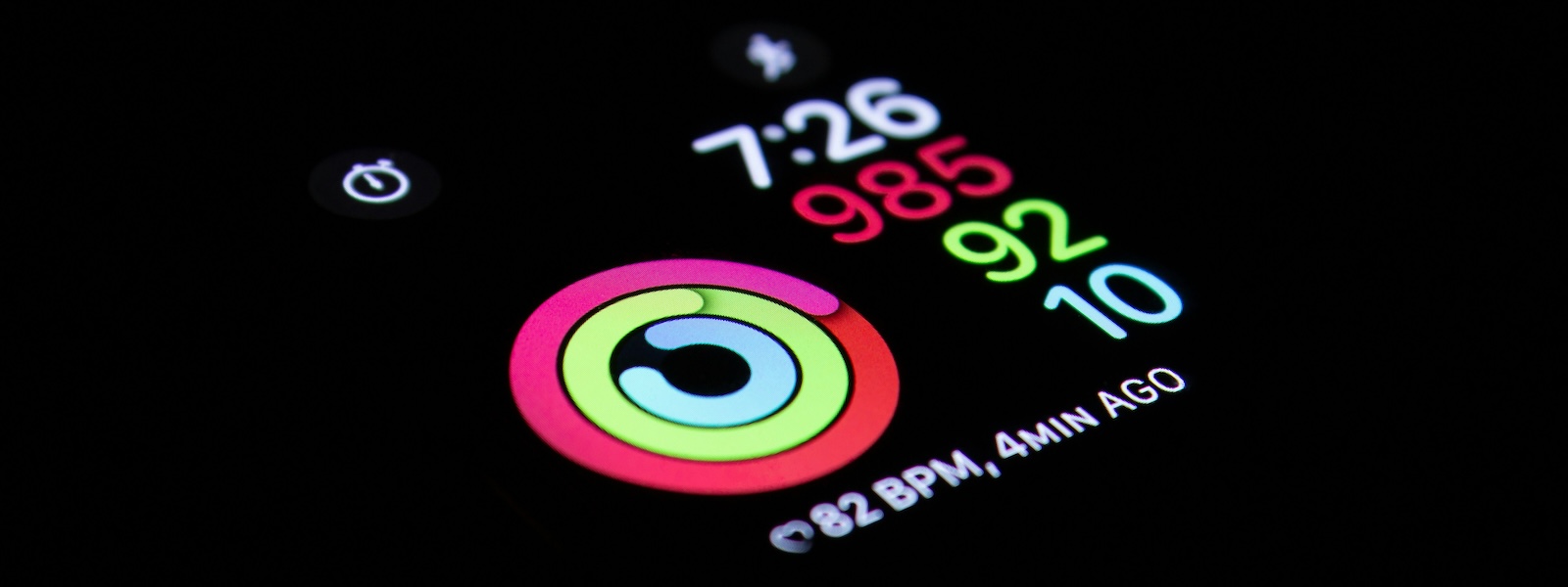A close-up photo of a phone screen showing a tracking app with various metrics.